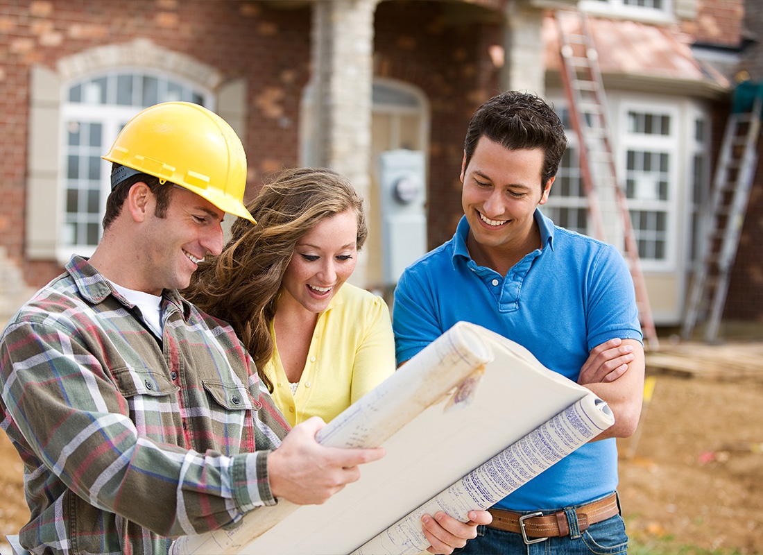 Insurance by Industry - Homeowners Excited to Look at Plans That a Contractor Prepared