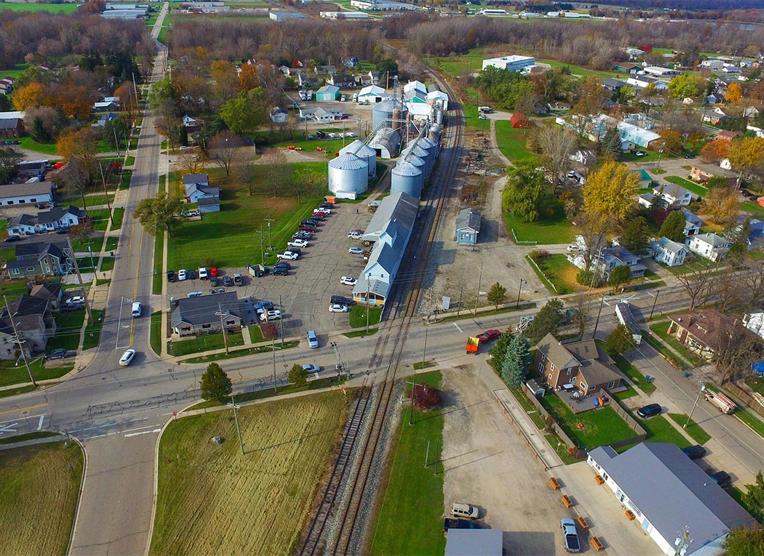 Contact - Aerial View of Small Town in Michigan During Fall